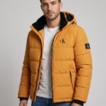 C K WINTER PADING JACKET . ( COLOUR - MUSTARD YELLOW )